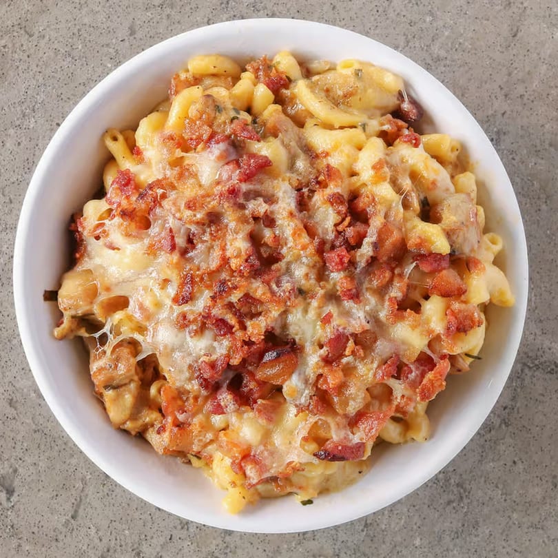 Incred-A-Bowl Food Co's healthy mac and cheese topped with crispy bacon bits.